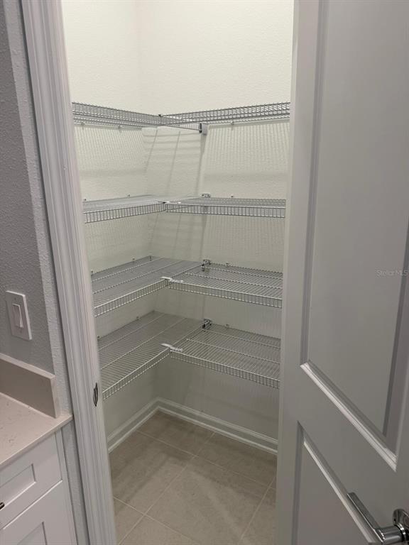 1770 Rider Rain Lane Apopka, FL 32703 - Photo 19 of 86 a view of walk in closet with empty racks