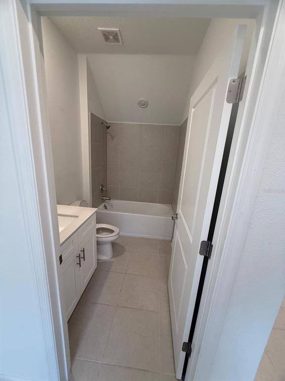 1770 Rider Rain Lane Apopka, FL 32703 - Photo 34 of 86 a bathroom with a sink a toilet and a tub