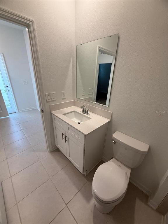1770 Rider Rain Lane Apopka, FL 32703 - Photo 37 of 86 a bathroom with a toilet sink and mirror