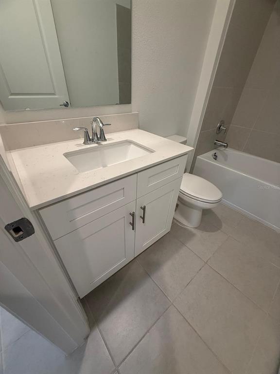 1770 Rider Rain Lane Apopka, FL 32703 - Photo 38 of 86 a bathroom with a sink a toilet and shower