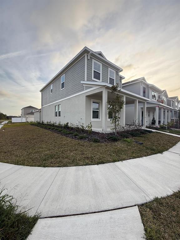 1770 Rider Rain Lane Apopka, FL 32703 - Photo 4 of 86 a front view of a house with a yard