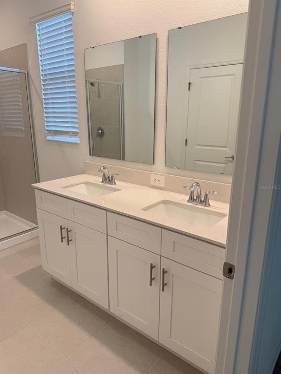 1770 Rider Rain Lane Apopka, FL 32703 - Photo 45 of 86 a bathroom with a sink and a mirror