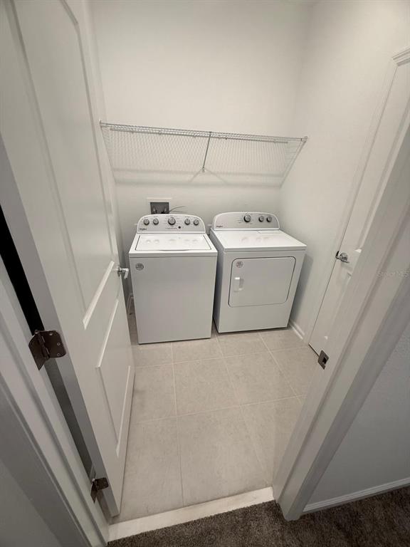 1770 Rider Rain Lane Apopka, FL 32703 - Photo 59 of 86 a utility room with dryer and washer