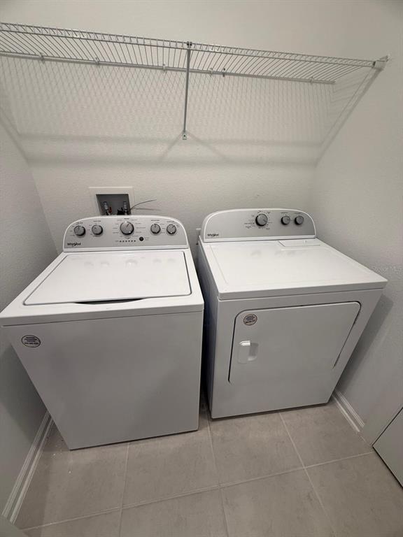 1770 Rider Rain Lane Apopka, FL 32703 - Photo 60 of 86 a utility room with dryer and washer