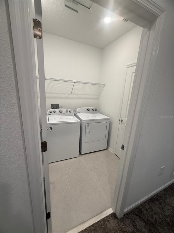 1770 Rider Rain Lane Apopka, FL 32703 - Photo 61 of 86 a utility room with dryer and washer