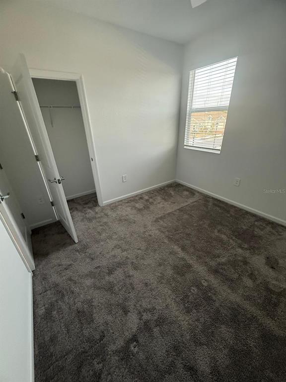 1770 Rider Rain Lane Apopka, FL 32703 - Photo 65 of 86 a view of an empty room and a window