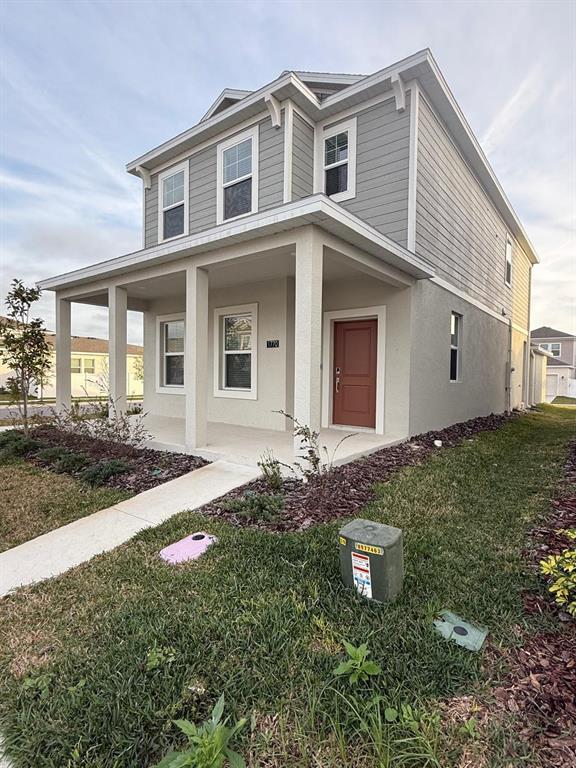 1770 Rider Rain Lane Apopka, FL 32703 - Photo 7 of 86 a front view of a house with a yard