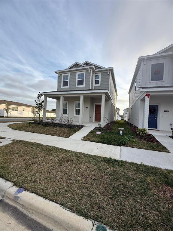 1770 Rider Rain Lane Apopka, FL 32703 - Photo 9 of 86 front view of a house with a yard