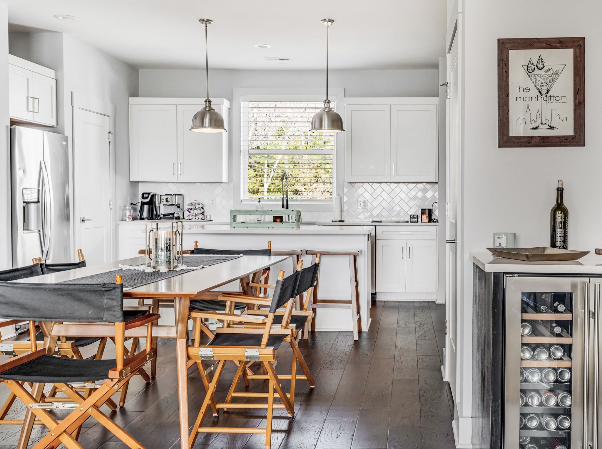 740 Inspiration Boulevard Madison, TN 37115 - Photo 12 of 55 a kitchen with stainless steel appliances a table and chairs in it