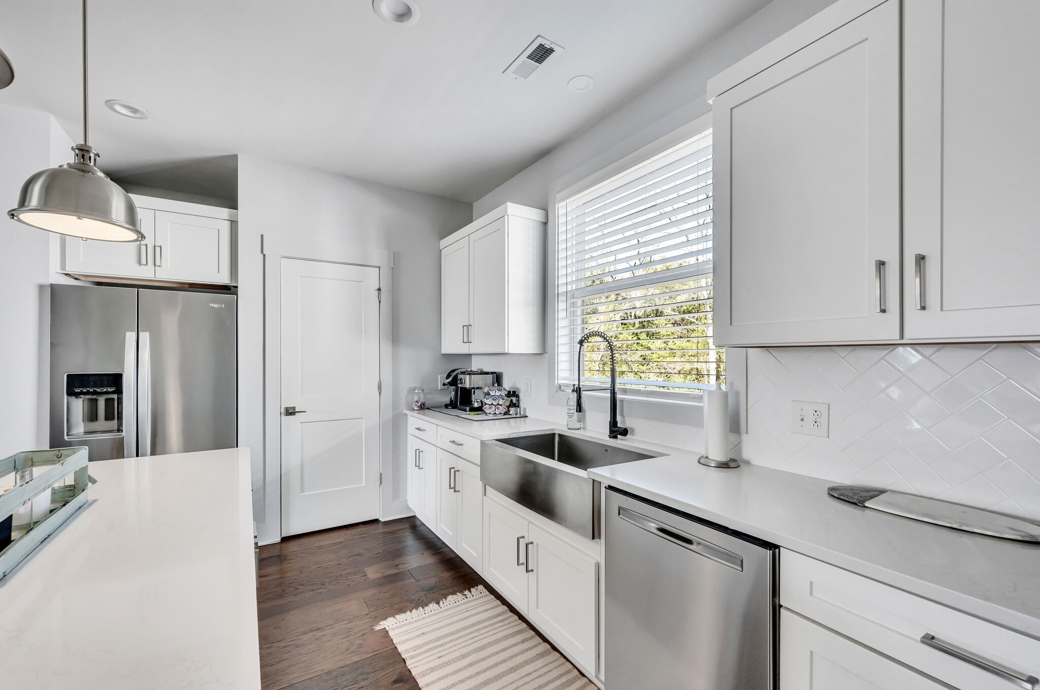 740 Inspiration Boulevard Madison, TN 37115 - Photo 20 of 55 a kitchen with white cabinets and white appliances