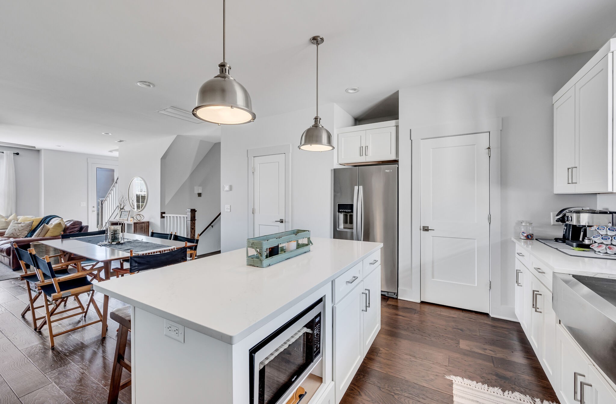 740 Inspiration Boulevard Madison, TN 37115 - Photo 21 of 55 a kitchen with stainless steel appliances a stove a sink island and a refrigerator with wooden floor