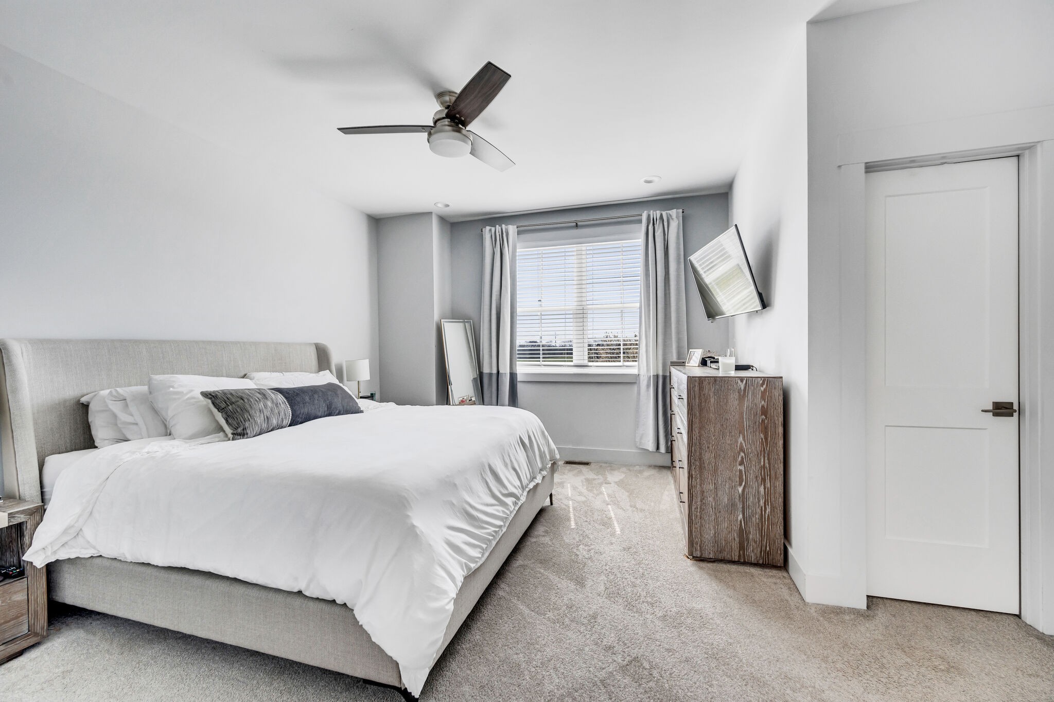 740 Inspiration Boulevard Madison, TN 37115 - Photo 42 of 55 a bedroom with a large bed and a chandelier