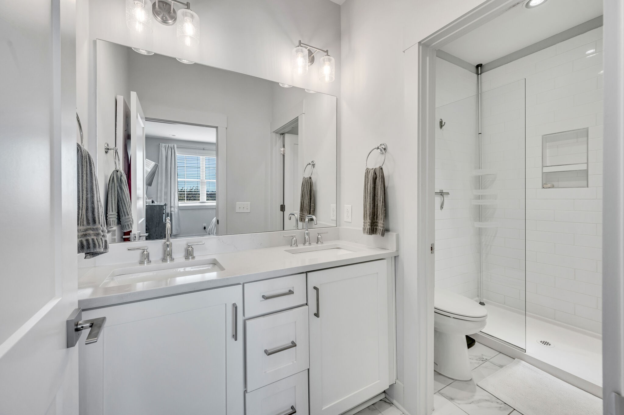 740 Inspiration Boulevard Madison, TN 37115 - Photo 43 of 55 a bathroom with a granite countertop sink a toilet and a mirror