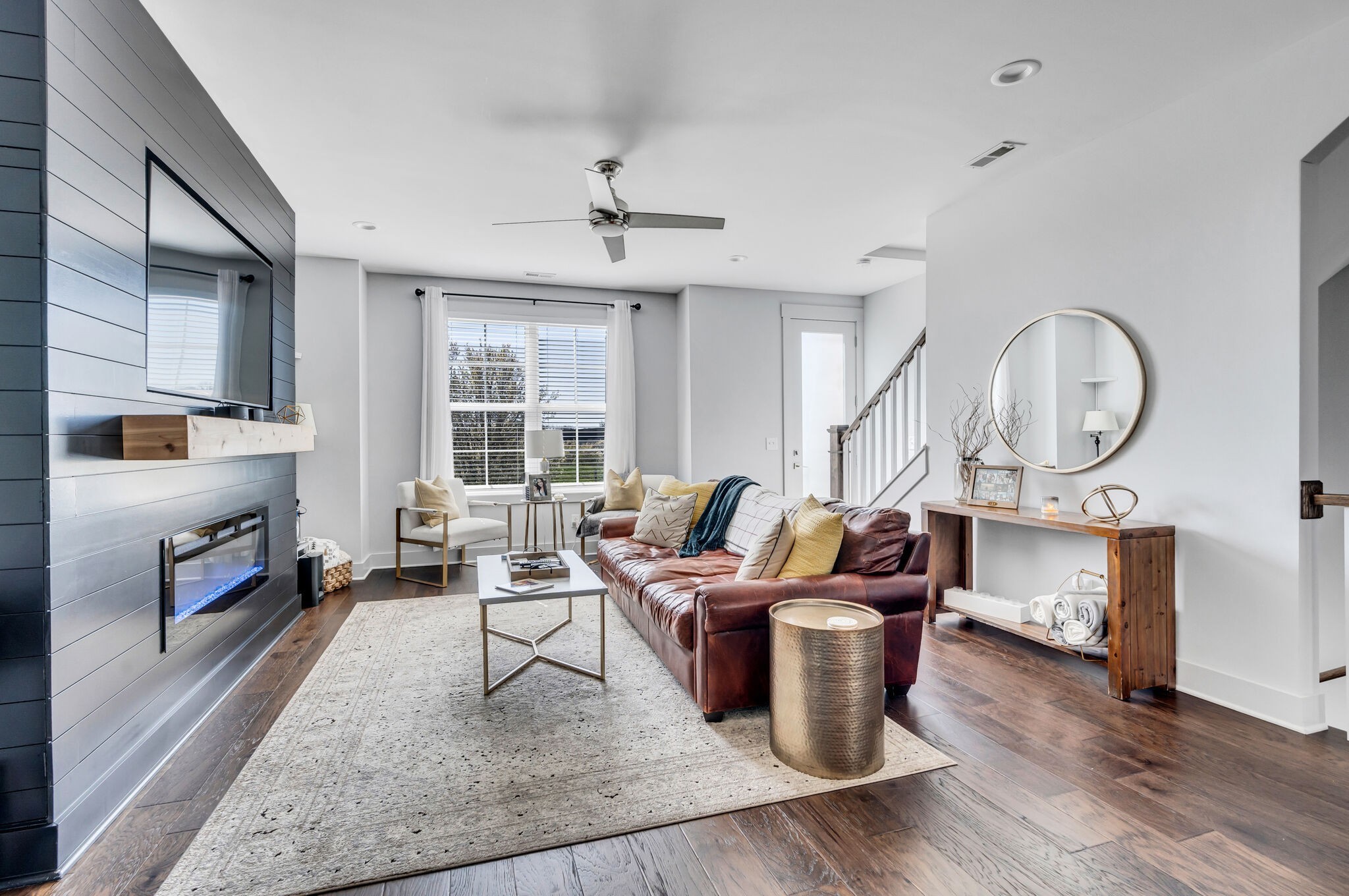 740 Inspiration Boulevard Madison, TN 37115 - Photo 8 of 55 a living room with furniture a fireplace and a large window