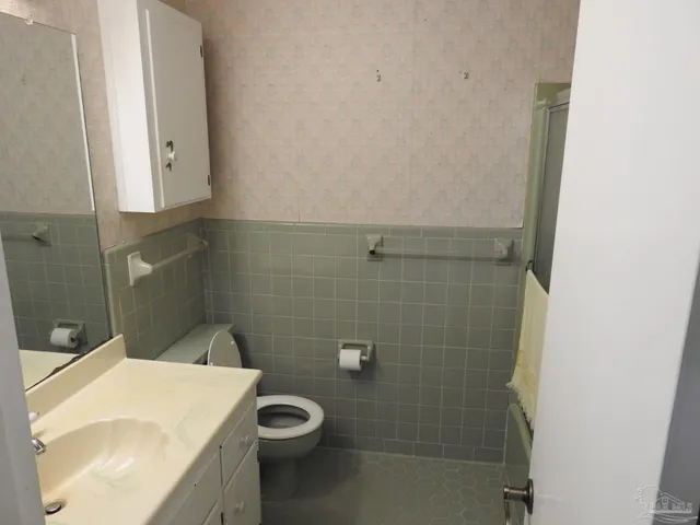 a view of an empty room with windows