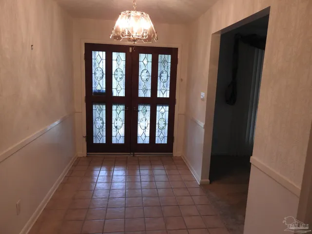 a view of entryway with a front door