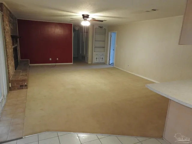 a view of empty room with windows