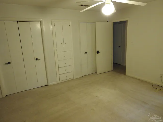 a bathroom with a sink a toilet and vanity