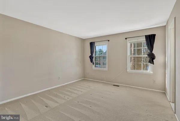 an empty room with windows