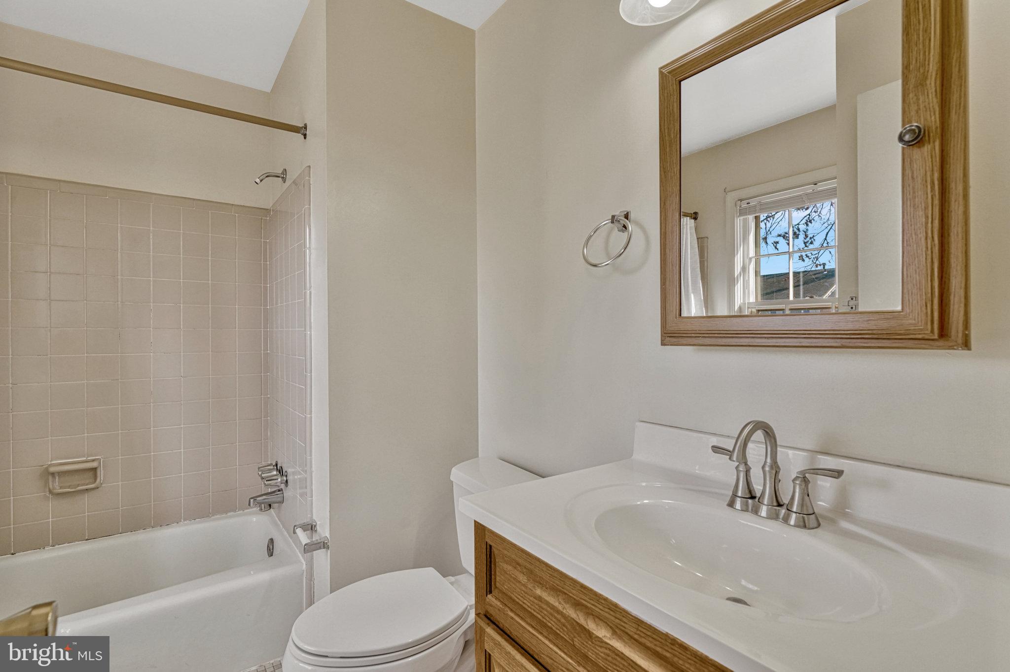 5540 Kendrick Lane Burke, VA 22015 - Photo 23 of 40 a bathroom with a sink toilet and shower