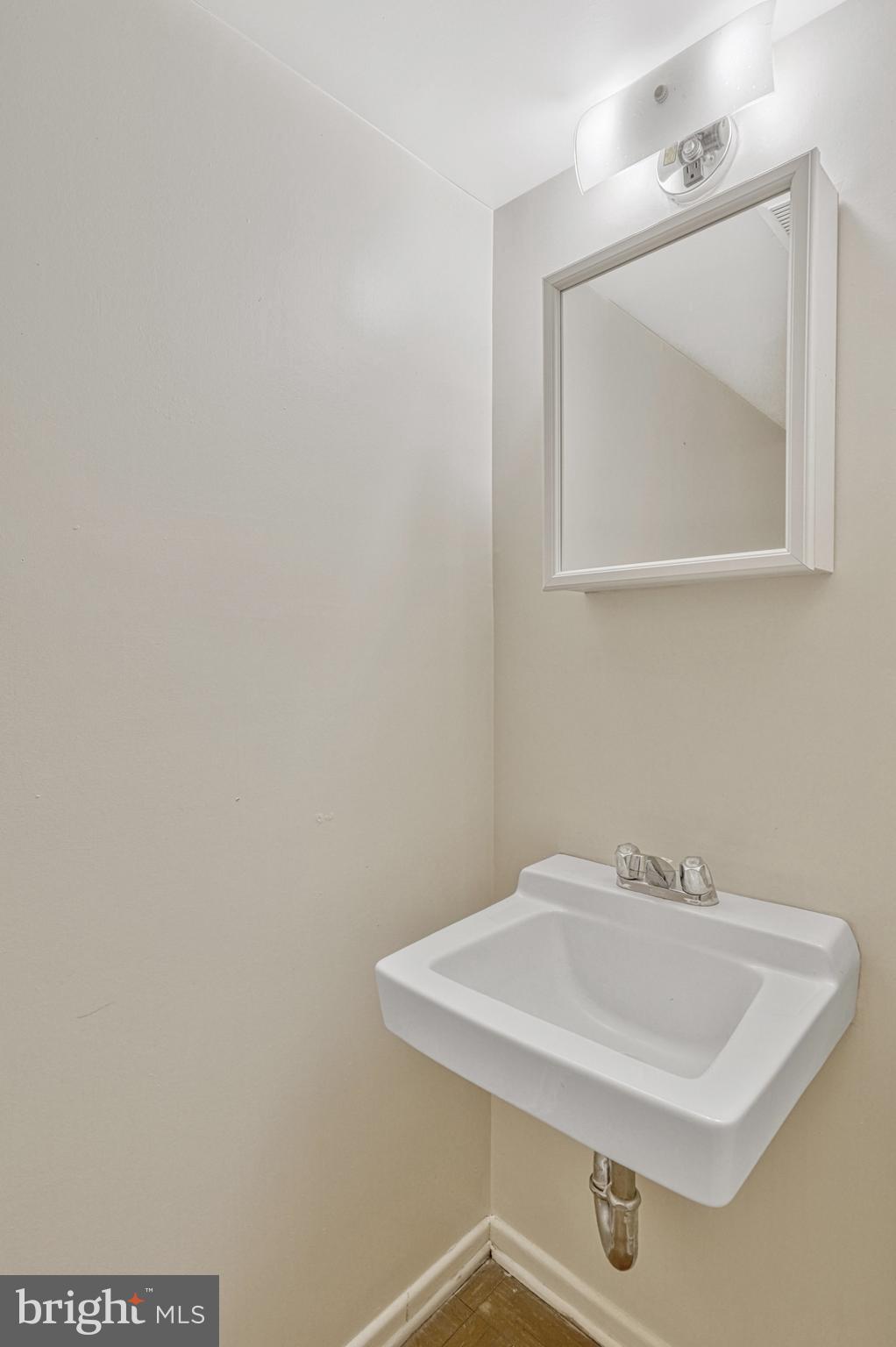 5540 Kendrick Lane Burke, VA 22015 - Photo 32 of 40 a bathroom with a sink and a mirror