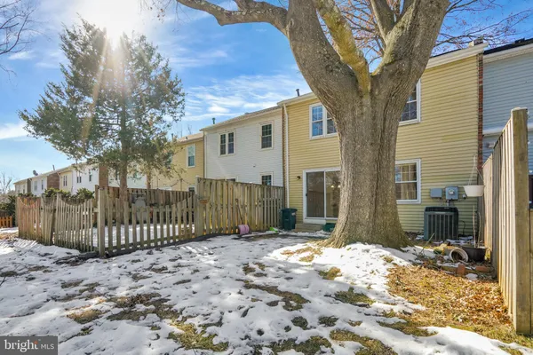 a view of a yard with a house and a tree