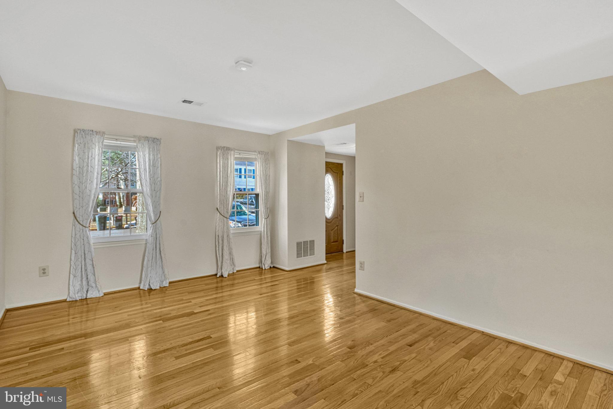 5540 Kendrick Lane Burke, VA 22015 - Photo 4 of 40 a view of empty room with wooden floor and fan