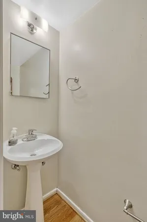 a bathroom with a sink and mirror