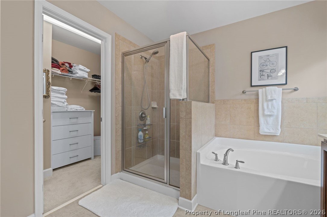 126 Pine Hawk Drive Spring Lake, NC 28390 - Photo 20 of 48 a bathroom with a bathtub a shower and a sink