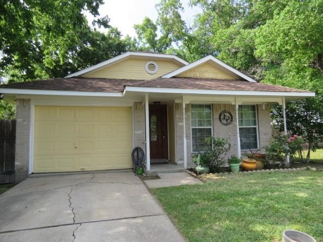 3115 Lorikeet Street Spring, TX 77373 - Photo 1 of 12 a front view of a house with garden