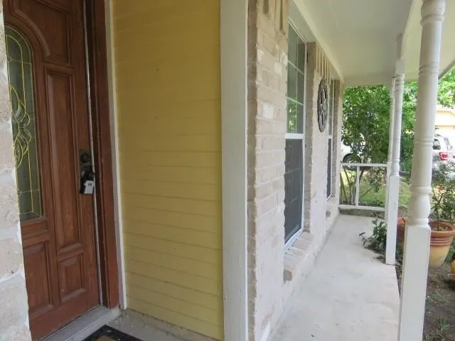 a view of a bathroom with a door and chair