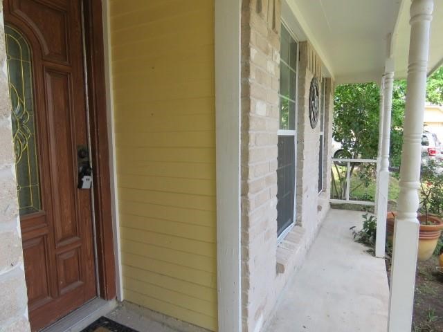 3115 Lorikeet Street Spring, TX 77373 - Photo 2 of 12 a view of a bathroom with a door and chair