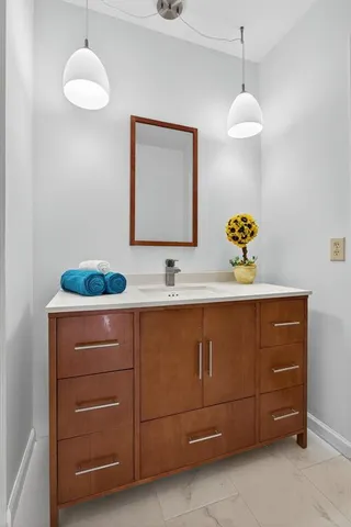 a bathroom with a sink and a mirror