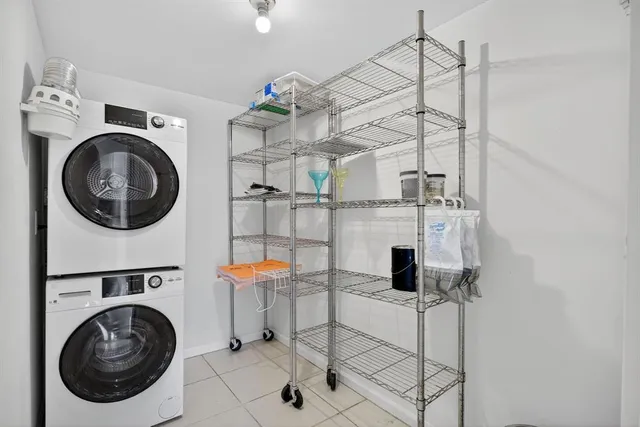 a view of a kitchen with a washer and dryer