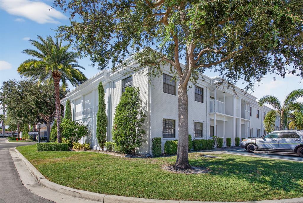 130 Cypress Club Drive, Unit 307 Pompano Beach, FL 33060 - Photo 18 of 35 a view of a house with a yard