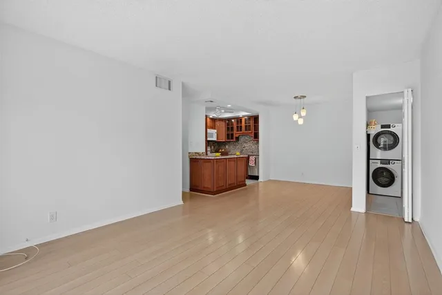 a view of a kitchen with wooden floor and cabinet