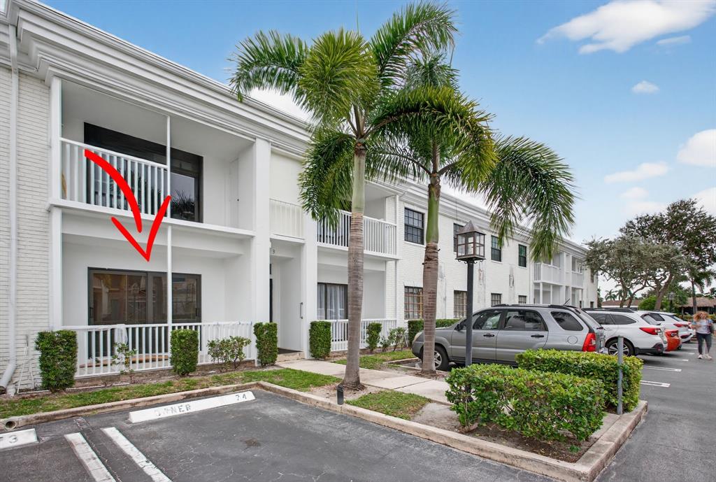 130 Cypress Club Drive, Unit 307 Pompano Beach, FL 33060 - Photo 2 of 35 a front view of multiple houses with yard