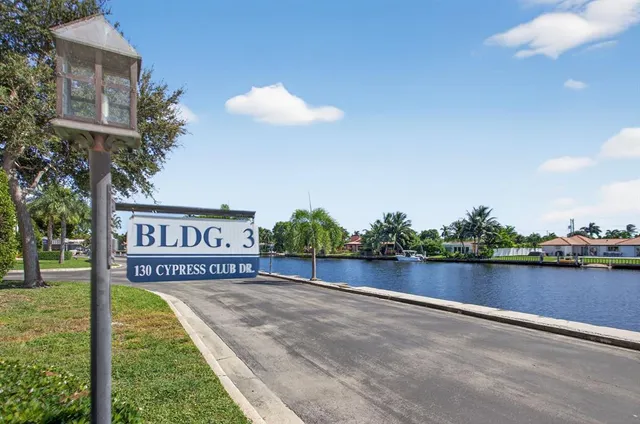 a view of a street with a building in the background