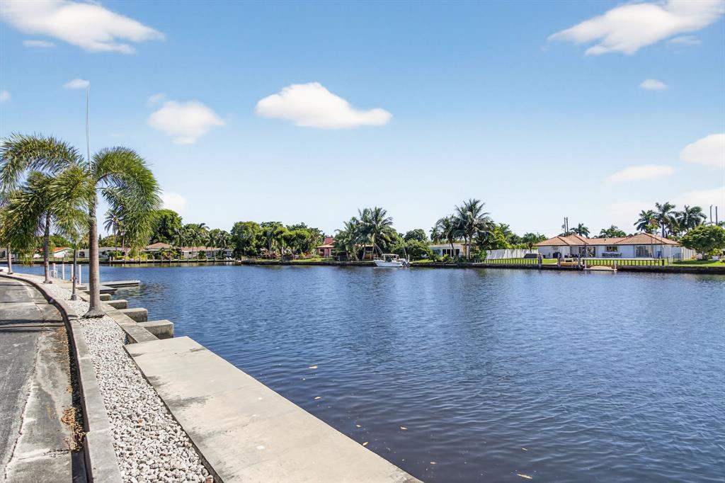 130 Cypress Club Drive, Unit 307 Pompano Beach, FL 33060 - Photo 29 of 35 a view of a lake