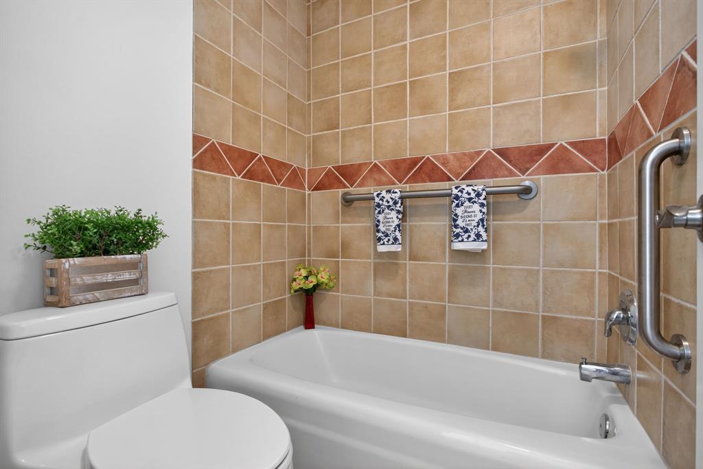 130 Cypress Club Drive, Unit 307 Pompano Beach, FL 33060 - Photo 10 of 35 a bathroom with a toilet and shower