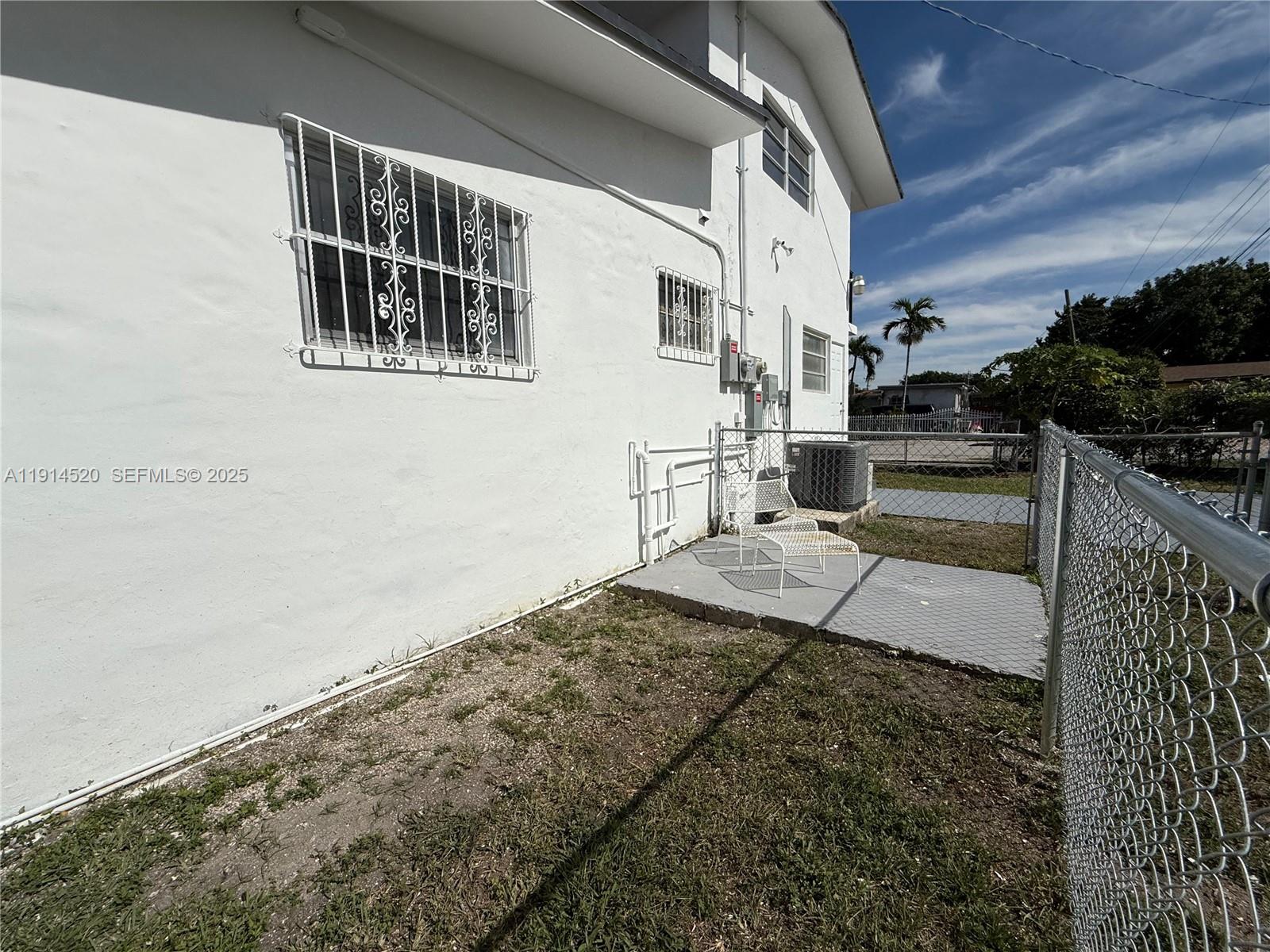 8860 Southwest 32nd Street, Unit BACK Miami, FL 33165 - Photo 6 of 6 a view of a porch with a floor to ceiling window