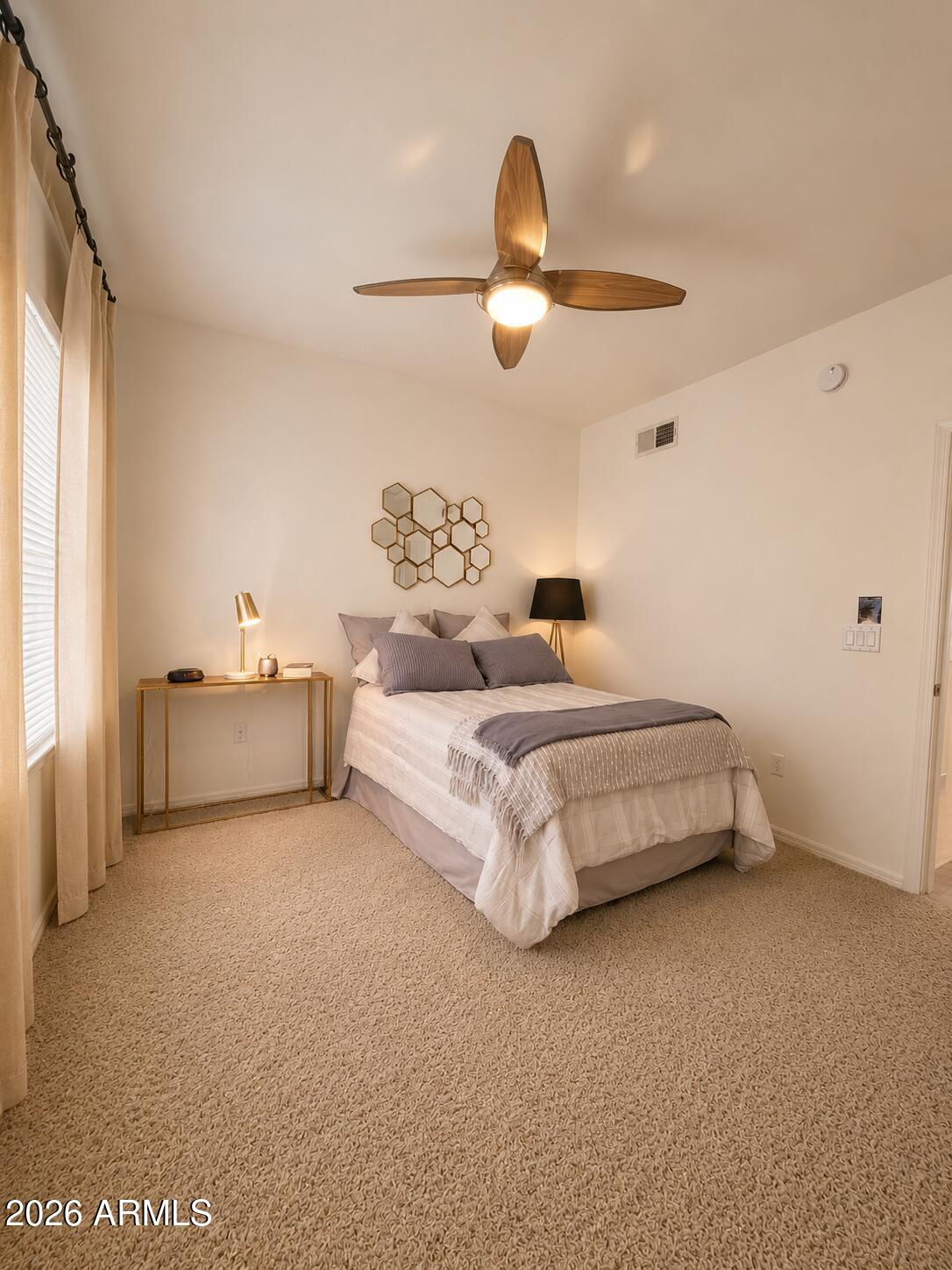 2150 West Alameda Road, Unit 1020 Phoenix, AZ 85085 - Photo 22 of 35 a bedroom with bed and window