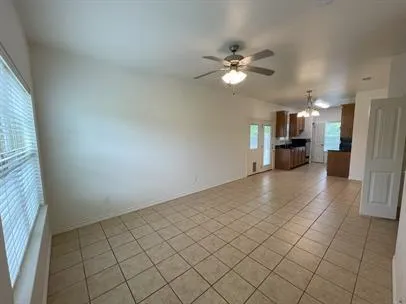 a view of a kitchen with a sink and a refrigerator