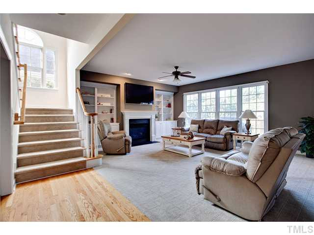 Huge family room boasts built-ins, new carpet, gas log FP, and new lighting. Den/Family/Great Room