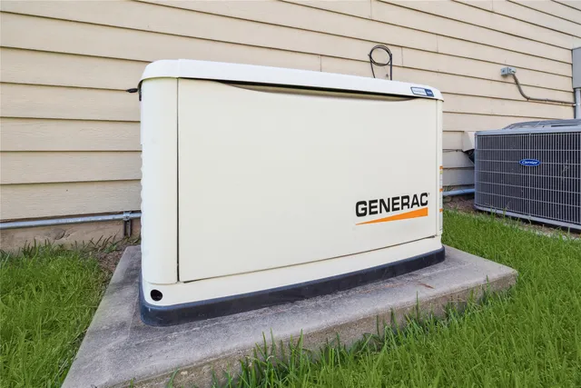 a view of a back yard of the house with a street
