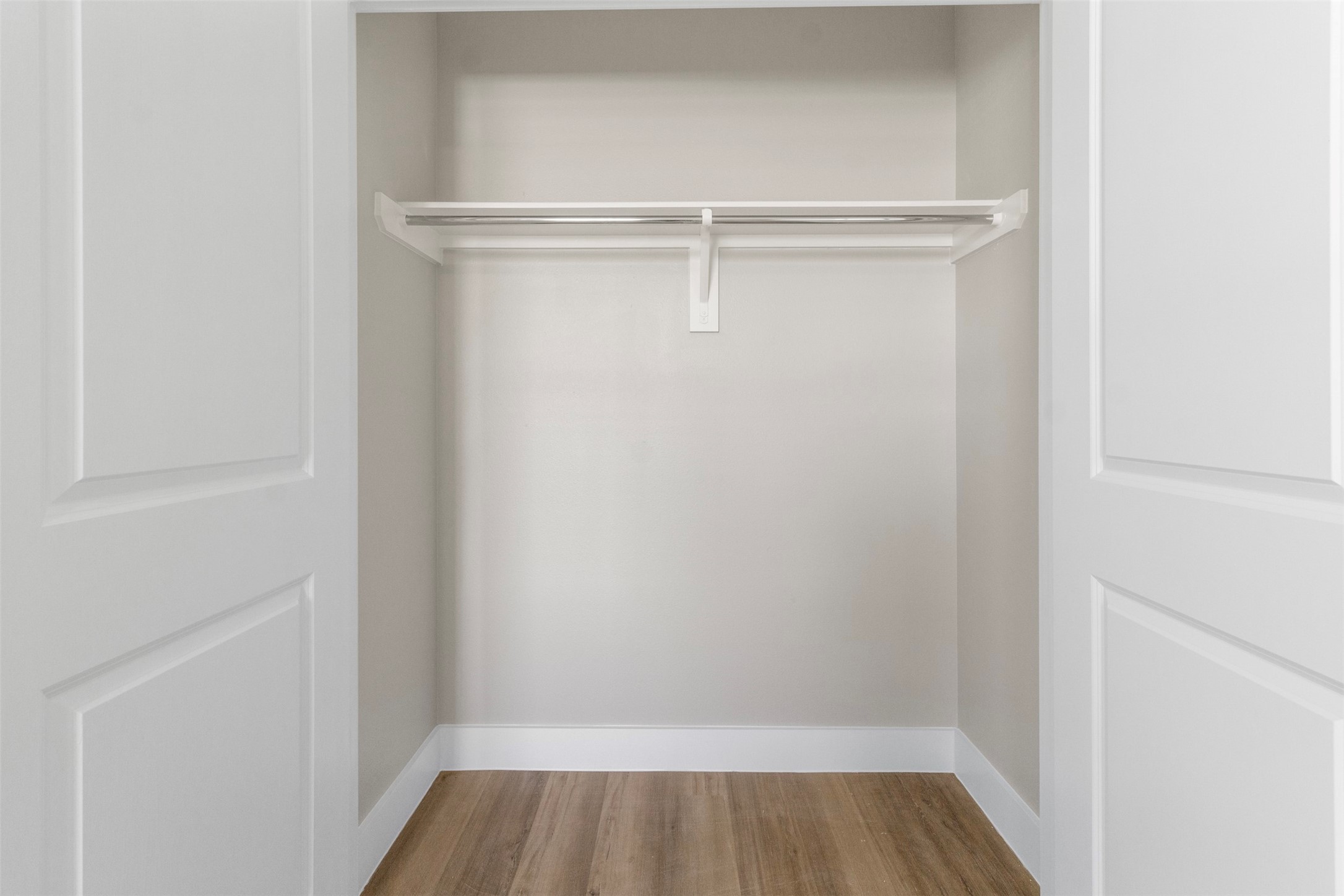 3152 South Cleveland Street Dayton, TX 77535 - Photo 11 of 22 a view of walk in closet with wooden floor