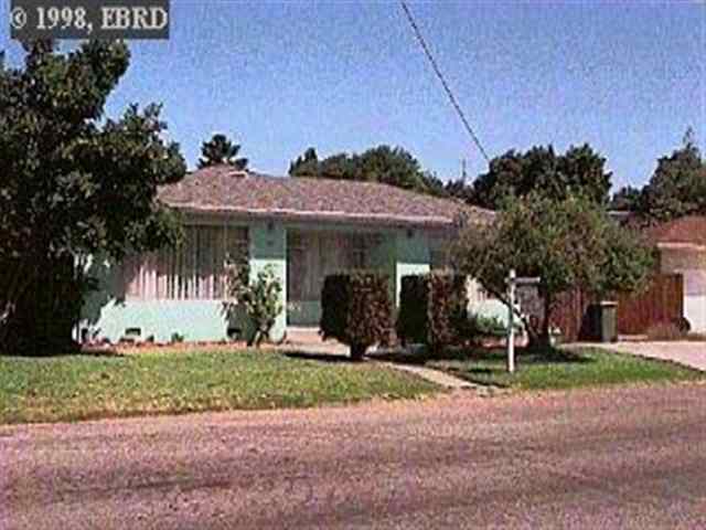824 Seventh Street Rodeo, CA 94572 - Photo 1 of 1 a front view of a house with garden