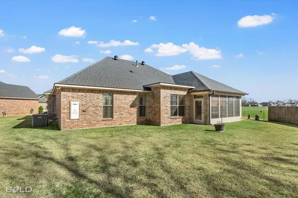 a view of a house with a yard and porch