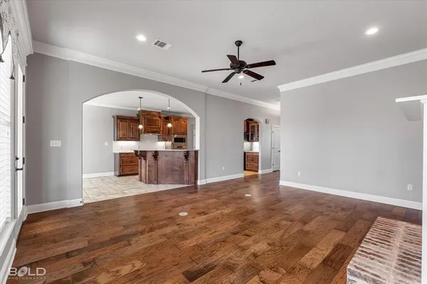 a view of a livingroom with a furniture wooden floor and window