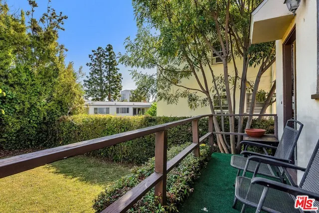 a view of balcony with furniture